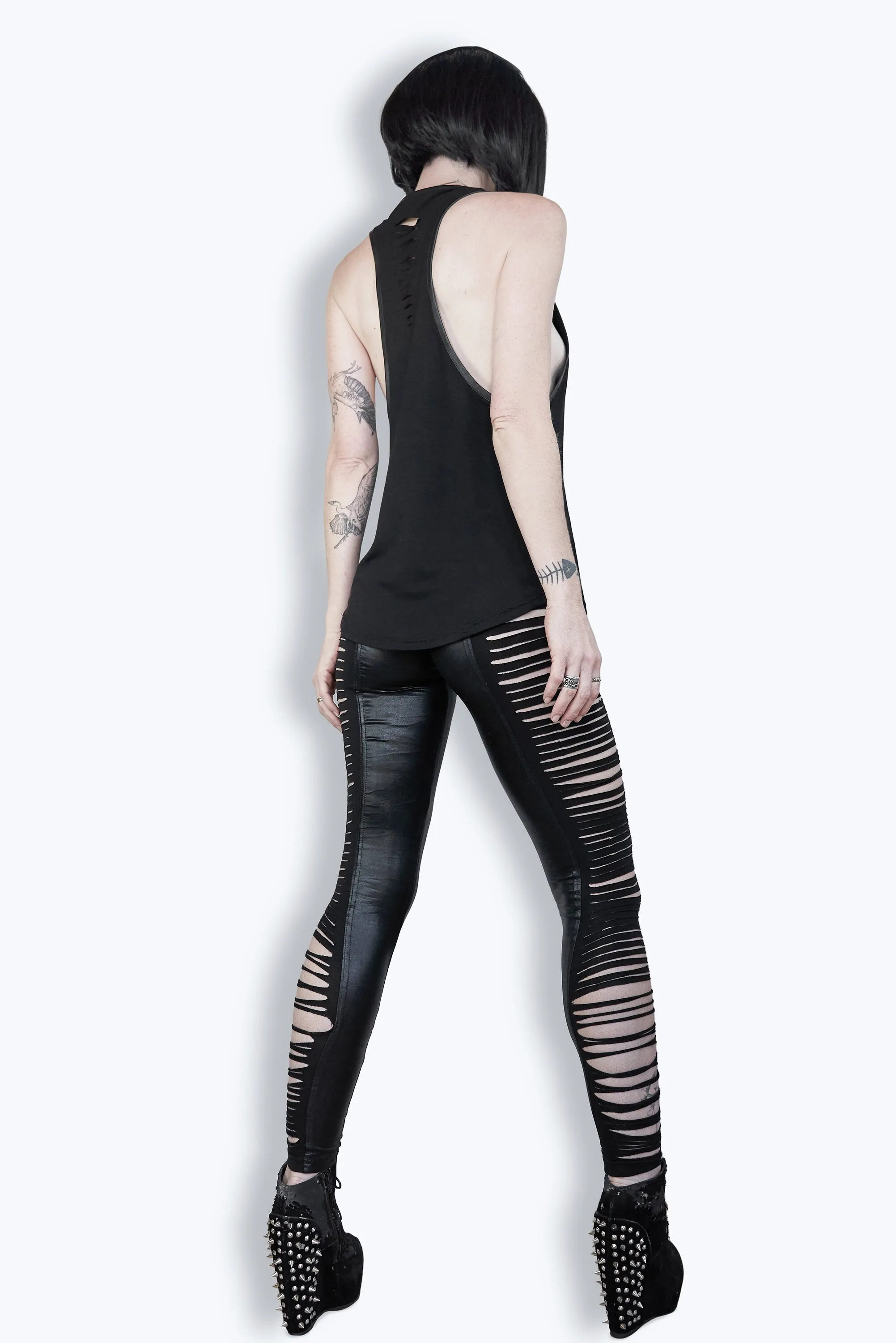 Slashed n cut leggings in wet look pleather